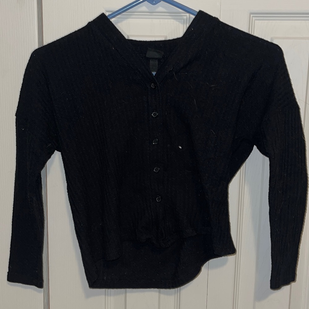 Black long sleeve buttons down the middle